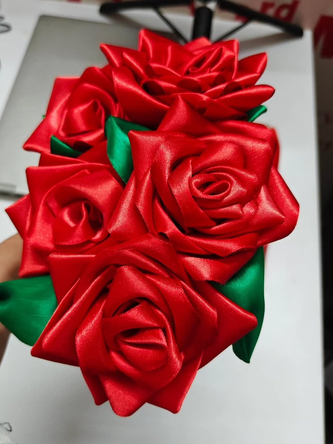 Each rose folded and stitched by hand